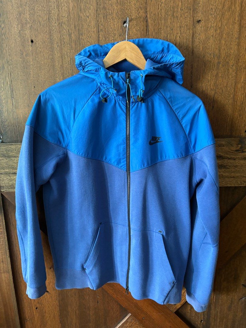NIKE Tech Fleece Jacket - LARGE (Category: Coats, Jackets and Outerwear) located in Pasig City. Submitted by dijos (Listing ID 1415842580, Image 1). Description: Nike Tech Fleece Jacket Hoodie Color: Royal Blue/Game Royal/Photo Blue Size: Large (fits M) Condition: 7.5/10 Issue: Glue on right front pocket dried, easily repaired via fabric glue or stitching. Last photo for reference only.