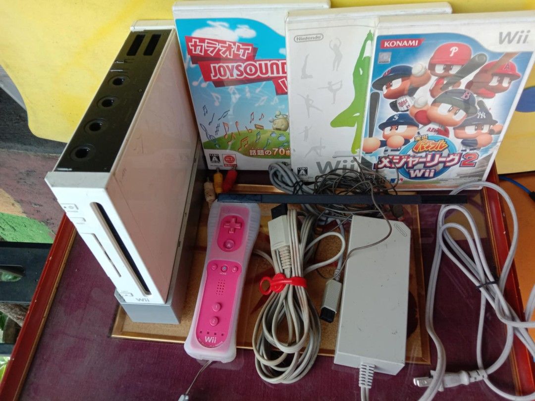 Nintendo Wii Console with Games (Category: Nintendo) located in Quezon City. Submitted by jpnvintageonline (Listing ID 1415863500, Image 3). Description: - White Nintendo Wii console - Pink remote with silicone cover - Games included: Karaoke Joysound Wii, fitness game, baseball game - Includes power adapter and sensor bar - All necessary cables are included - Ready to play!.