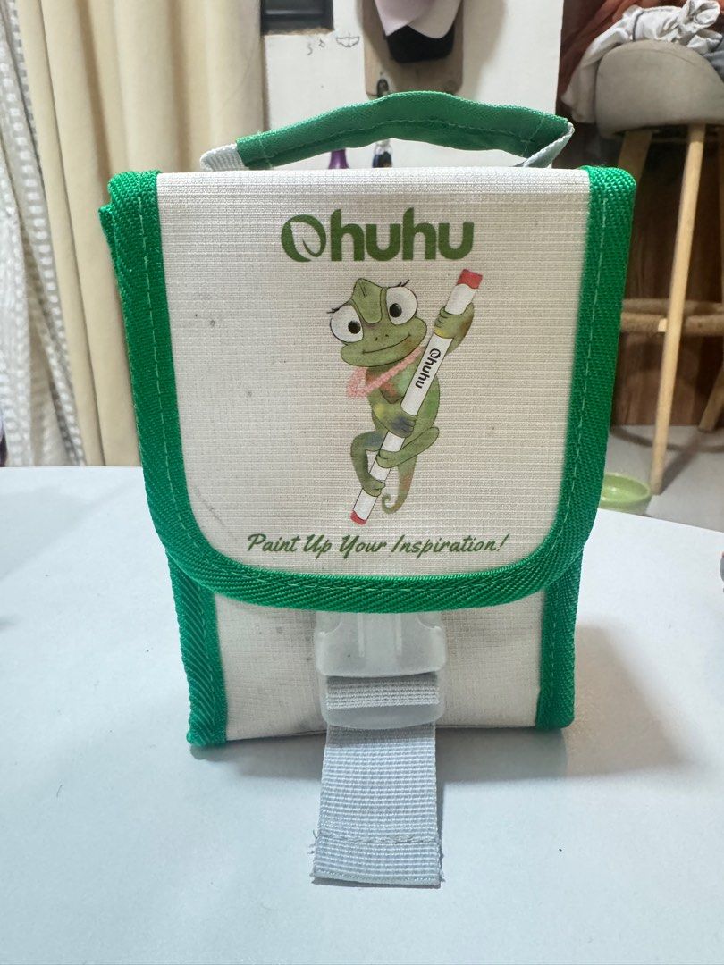 Ohuhu Marker Set with Case (Category: Stationery & School Supplies) located in Imus. Submitted by garetho1923 (Listing ID 1415957242, Image 1). Description: - Ohuhu marker set - Comes with a green and white carrying case with Ohuhu logo - Includes a variety of colored markers - Markers are labeled with color codes - Carrying case has a handle for easy transport.