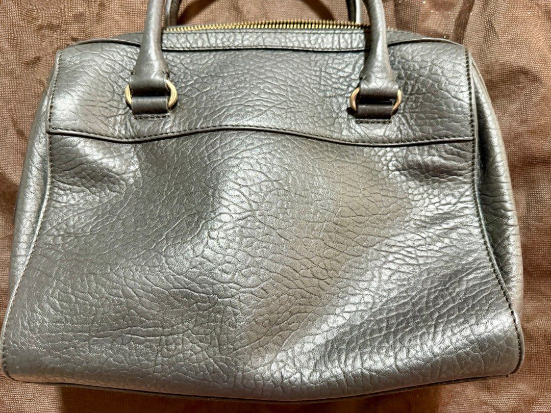 Original Kate Spade Perforated Leather Handbag (Category: Luxury Bags & Wallets) located in Pasig City. Submitted by gethege (Listing ID 1415851146, Image 2). Description: - Kate Spade handbag - Perforated design - Top zipper closure - Dual top handles - Gold-toned hardware - Includes dust bag - Textured leather - Structured shape - no stains or tear - complete with strap.