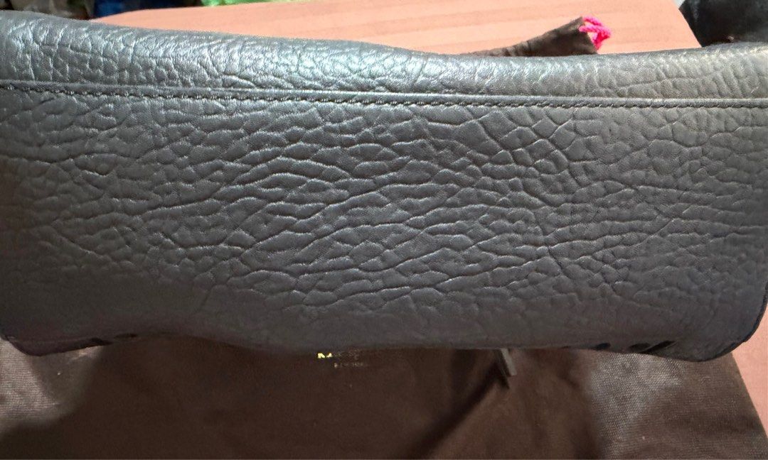 Original Kate Spade Perforated Leather Handbag (Category: Luxury Bags & Wallets) located in Pasig City. Submitted by gethege (Listing ID 1415851146, Image 3). Description: - Kate Spade handbag - Perforated design - Top zipper closure - Dual top handles - Gold-toned hardware - Includes dust bag - Textured leather - Structured shape - no stains or tear - complete with strap.