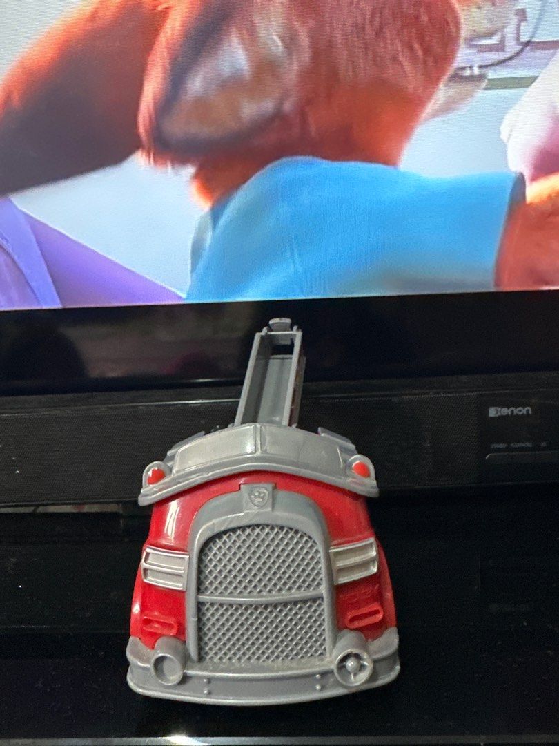 Paw Patrol Marshall Fire Truck Toy (Category: Kids Toys) located in Quezon City. Submitted by deesuns (Listing ID 1415850121, Image 2). Description: - Paw Patrol Marshall fire truck toy - Red with silver accents - Extendable ladder - Features the Paw Patrol logo - Made of plastic - Number "03" on the side.