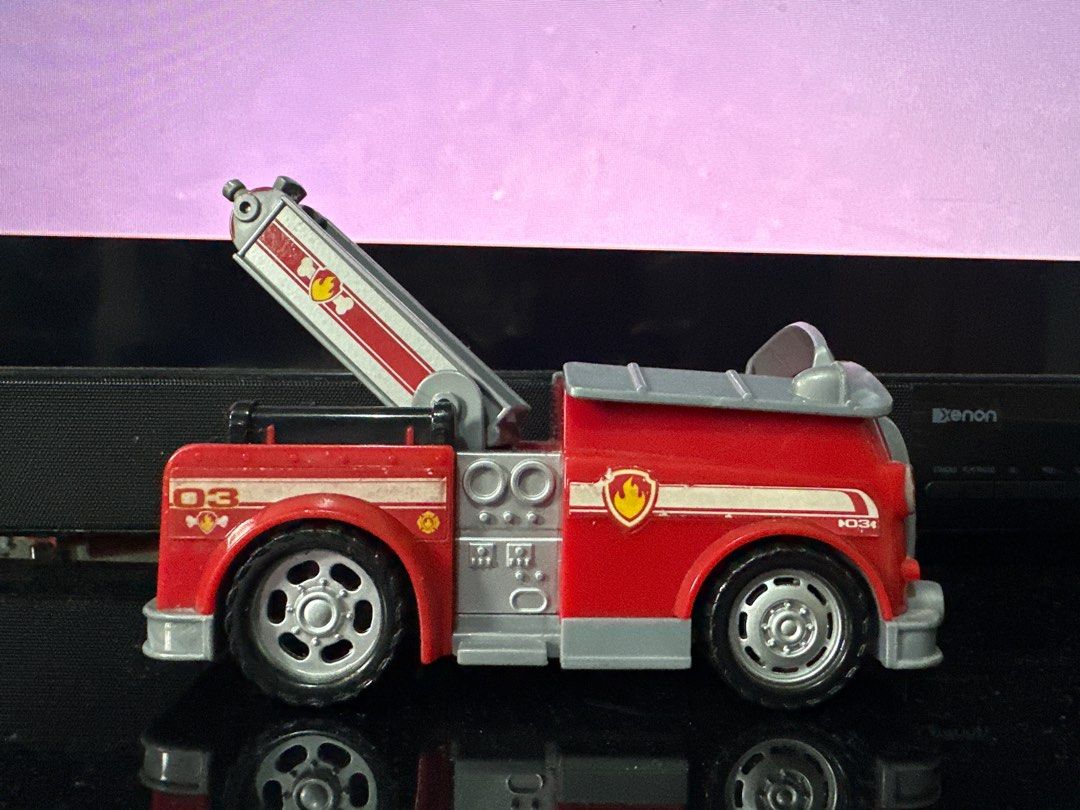 Paw Patrol Marshall Fire Truck Toy (Category: Kids Toys) located in Quezon City. Submitted by deesuns (Listing ID 1415850121, Image 3). Description: - Paw Patrol Marshall fire truck toy - Red with silver accents - Extendable ladder - Features the Paw Patrol logo - Made of plastic - Number "03" on the side.