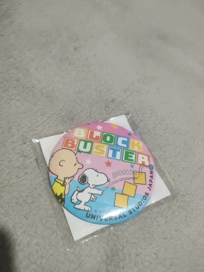 Peanuts Universal Studios Japan Blockbuster Pin (Category: Character Goods) located in Davao. Submitted by mengsmixitems (Listing ID 1415941273, Image 1). Description: - Universal Studios Japan pin featuring Snoopy and Charlie Brown. - Brand new, still in original packaging. - Eye-catching "Blockbuster" design. - Packaging includes Japanese text. - A must-have collectible for Peanuts enthusiasts!.