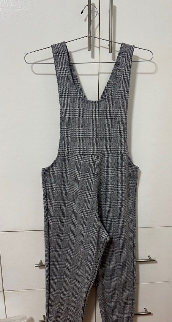 Plaid Jumpsuit (Category: Jumpsuits) located in Mandaluyong City. Submitted by mainesells_ (Listing ID 1416005077, Image 1). Description: - Classic gray plaid pattern with zipper closure - Stretchy material - 118 cm length - 25 cm shoulder to shoulder width - 38 cm below waist width.
