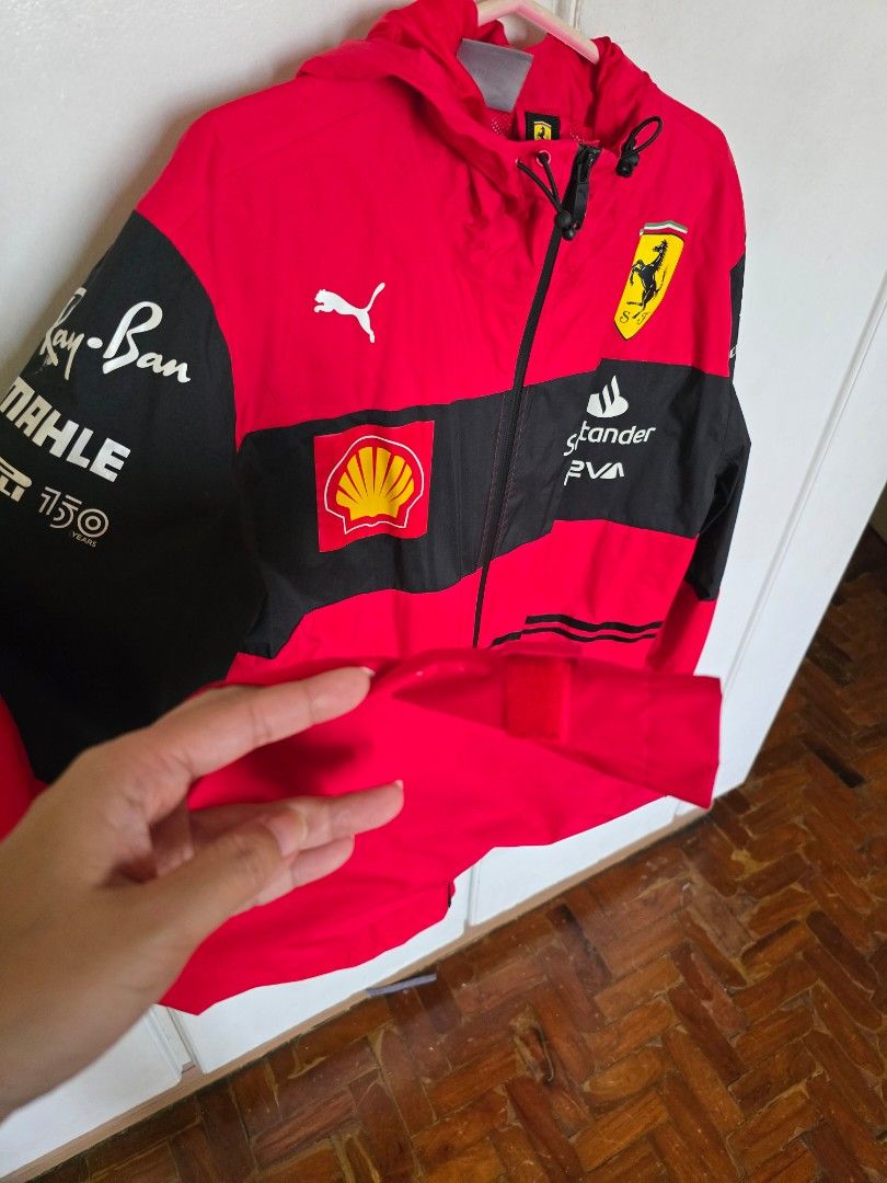 Puma Ferrari Jacket (Category: Coats, Jackets and Outerwear) located in Quezon City. Submitted by quirkfox77 (Listing ID 1415909067, Image 3). Description: - Puma Ferrari F1 2022 - Size: S - Color: Red and black - Features: Hood and zipper closure - Logos: Ferrari, Shell, and Puma - Design: Black stripes on sleeves - No flaws! - Bought from FuelForFans for €168 (Php 11k) RFS: Carlo Sainz Fan, so I've switch to Williams now. Open to reasonable off