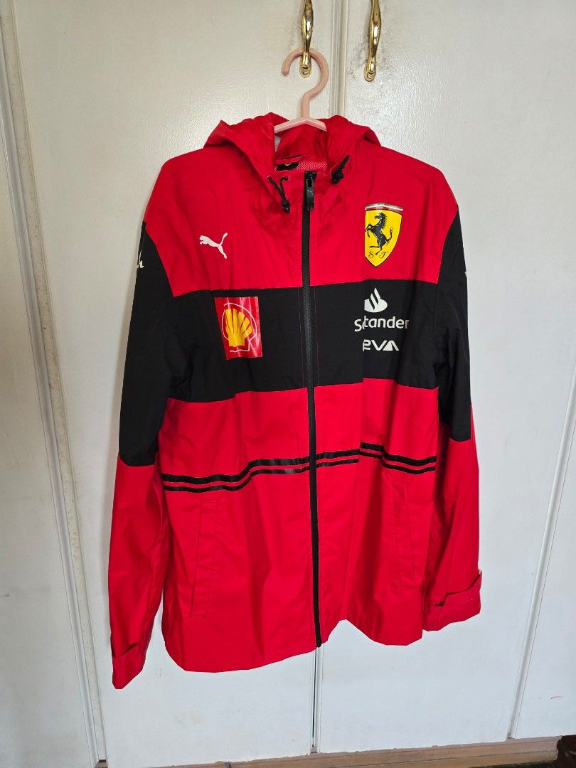 Puma Ferrari Jacket (Category: Coats, Jackets and Outerwear) located in Quezon City. Submitted by quirkfox77 (Listing ID 1415909067, Image 1). Description: - Puma Ferrari F1 2022 - Size: S - Color: Red and black - Features: Hood and zipper closure - Logos: Ferrari, Shell, and Puma - Design: Black stripes on sleeves - No flaws! - Bought from FuelForFans for €168 (Php 11k) RFS: Carlo Sainz Fan, so I've switch to Williams now. Open to reasonable off