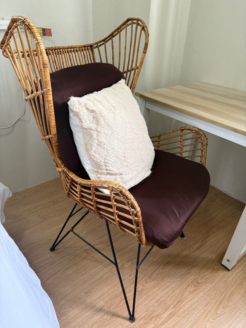 RUSH Rattan Wicker Chair with Cushion (Category: Chairs) located in Quezon City. Submitted by wolfkeith (Listing ID 1415873883, Image 3). Description: Locally made stylish rattan wicker chair Includes: -free foldable seat cushion with 2 washable covers - fluffy white pillow with washable cover Features: - Unique high-back design - Black metal legs - Adds a touch of bohemian style - Sturdy and well-constructed Also selling table and lamp as a set 