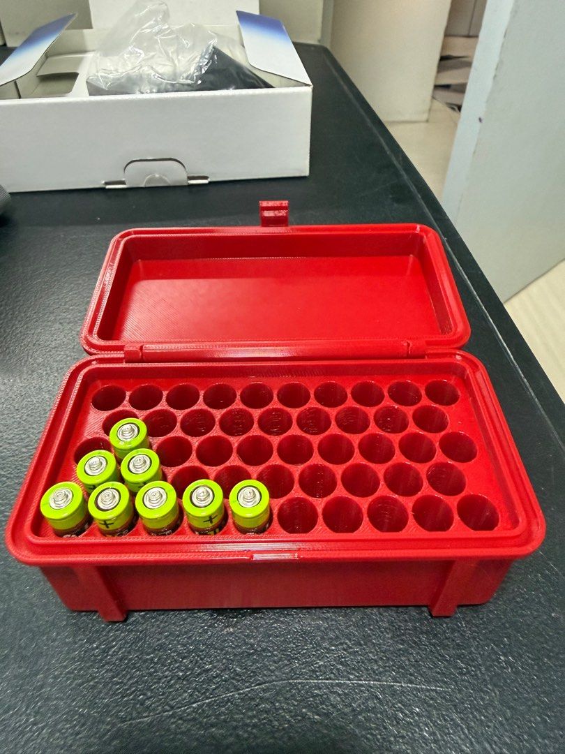 Red Battery Case for AAA Batteries (Category: Batteries & Chargers) located in Subic. Submitted by robertmfernandez (Listing ID 1416004861, Image 2). Description: - Rugged design - Red AAA battery case - Designed for AAA batteries - Multiple slots for organization - Hinged lid with latch - Keeps batteries secure - Convenient for storage and transport.