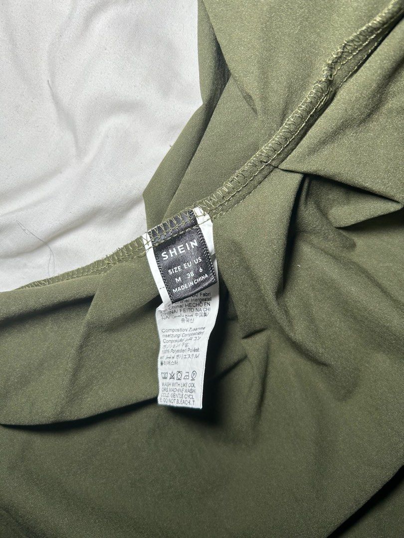SHEIN One Shoulder Top (Category: Sleeveless) located in Manila. Submitted by tonsdeclutter (Listing ID 1415981862, Image 2). Description: - SHEIN olive green one-shoulder top - Size: M (EU 38, US 4) - Asymmetrical design - Draped front - Lightweight fabric - Perfect for a chic outfit - Used once - Rfs: Gained a bit of weight .