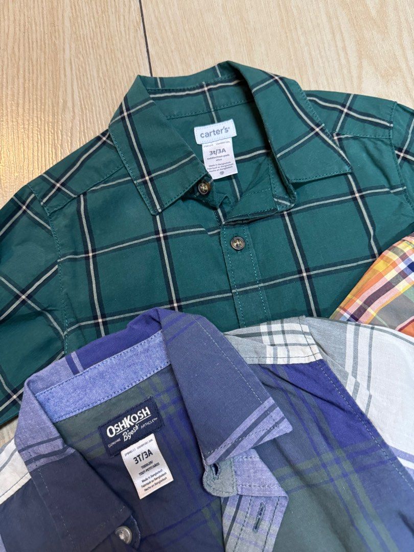 Take All: Branded Polos for Toddlers Size 3 (Category: Babies & Kids Fashion) located in Pasig City. Submitted by extrac (Listing ID 1415903205, Image 2). Description: Take all: Toddler plaid shirt bundle - Includes shirts from Carter's, Oshkosh B'gosh, and Kenneth Cole - Size: 3T - Features various plaid patterns (green, blue, orange, etc.) - Button-down closures - Collared necks - Perfect for everyday wear.
