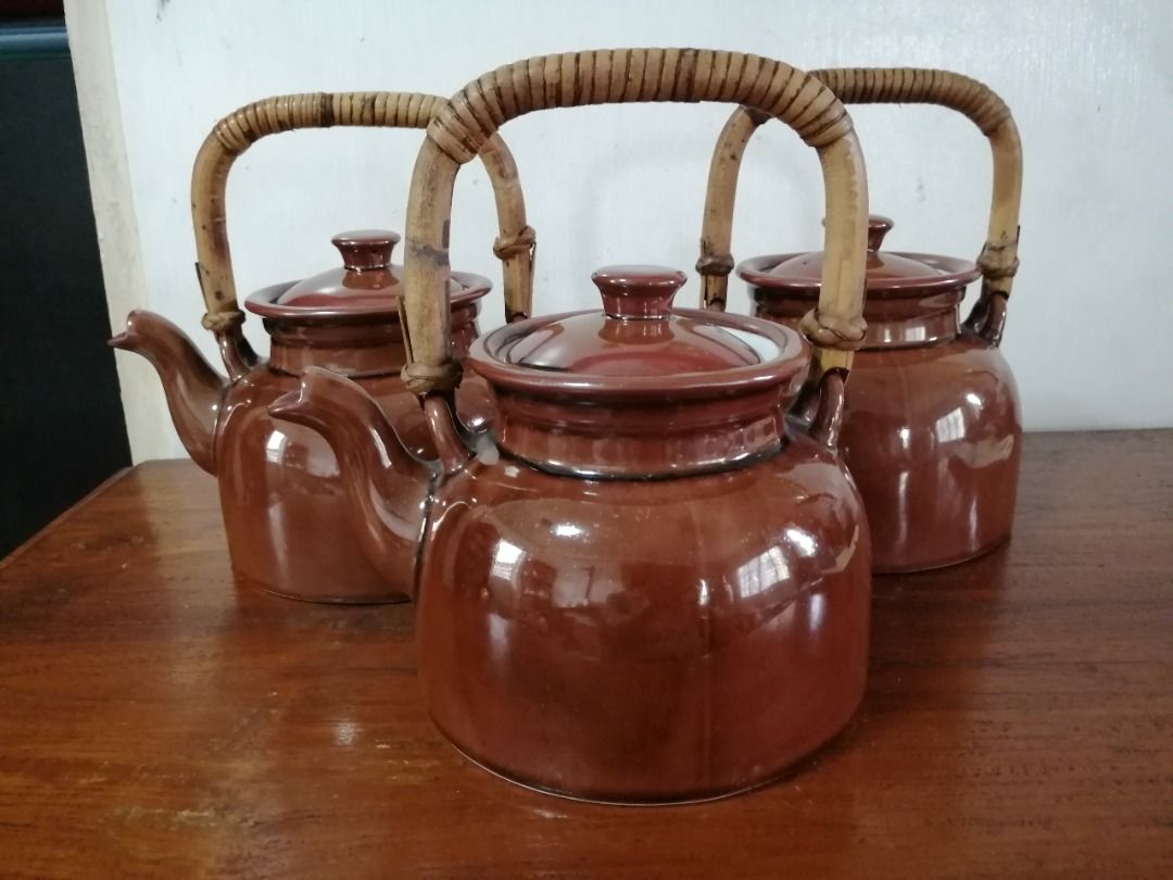 Vintage Brown Ceramic Teapot with Rattan Handle (Category: Coffee & Tea Tableware) located in Taytay. Submitted by gara1124 (Listing ID 1416006495, Image 1). Description: - Vintage brown ceramic teapot - Features a charming rattan handle - Includes a matching lid - Base diameter: approximately 6 inches Location: near Tikling, Taytay NO COD Payment upon pick up.
