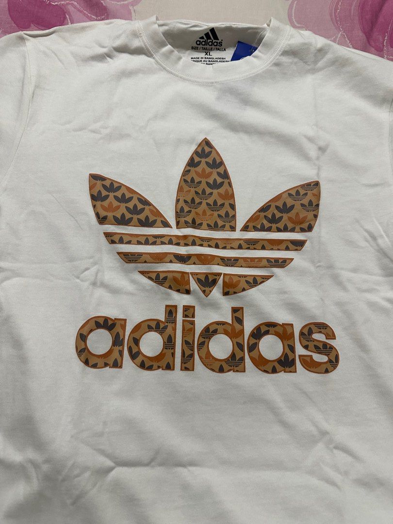 Adidas Trefoil Graphic Tee XL (Category: Tshirts & Polo Shirts ) located in Manila. Submitted by shobesclosetxx (Listing ID 1416168808, Image 1). Description: Selling for my Ahia/Brother Brand new and unused It’s still negotiable RFS: It doesn’t fit him and he doesn’t like tees with big logos.