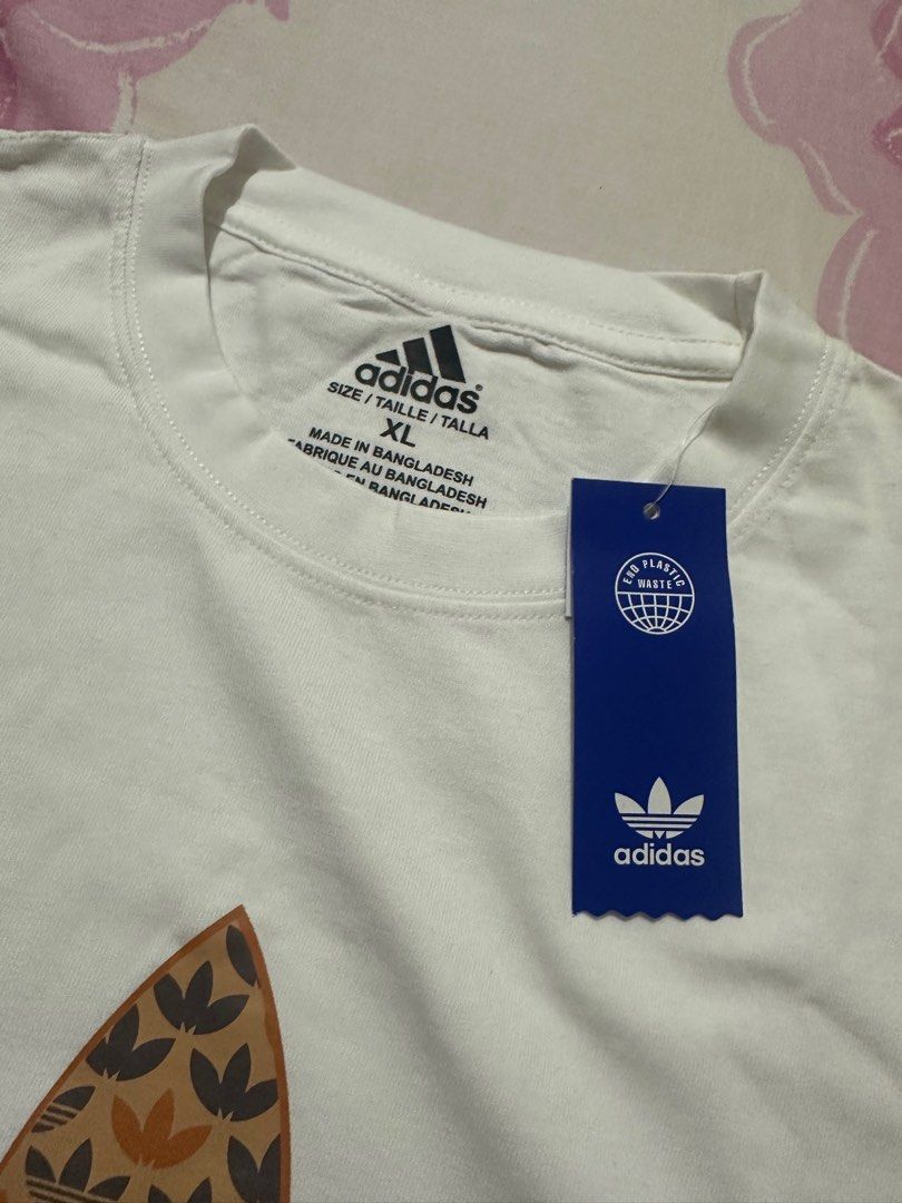 Adidas Trefoil Graphic Tee XL (Category: Tshirts & Polo Shirts ) located in Manila. Submitted by shobesclosetxx (Listing ID 1416168808, Image 3). Description: Selling for my Ahia/Brother Brand new and unused It’s still negotiable RFS: It doesn’t fit him and he doesn’t like tees with big logos.