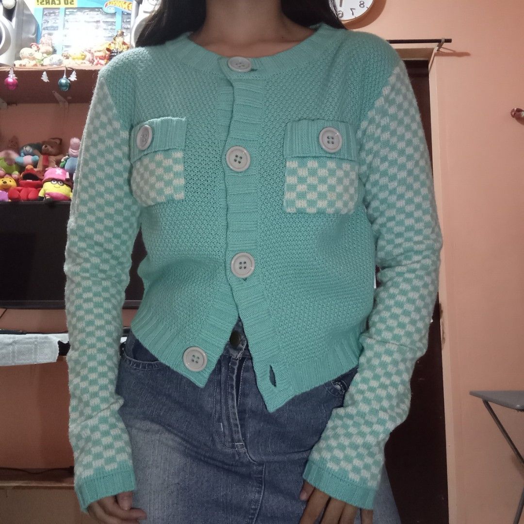 Agape Checkered Cardigan (Category: Coats, Jackets and Outerwear) located in Talisay. Submitted by peonisces (Listing ID 1416094357, Image 2). Description: ๑ fits small to semi m ๑ color rate: 10/10 ๑ flaw: little stain only - Light teal cardigan - Unique checkered pattern on sleeves and pockets - Button-up front - Two front pockets - Brand tag visible - Stylish and comfortable.