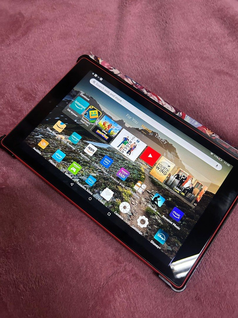 Amazon Fire HD 10 Tablet (Category: Android) located in Iloilo. Submitted by luna0618 (Listing ID 1416168876, Image 2). Description: * FREE CASE! - Amazon Fire HD 10 tablet (red) - Includes protective case with anime artwork - Access to apps: YouTube, Netflix, Amazon Music - Features a vibrant display - Runs on Fire OS - Amazon logo on the back.