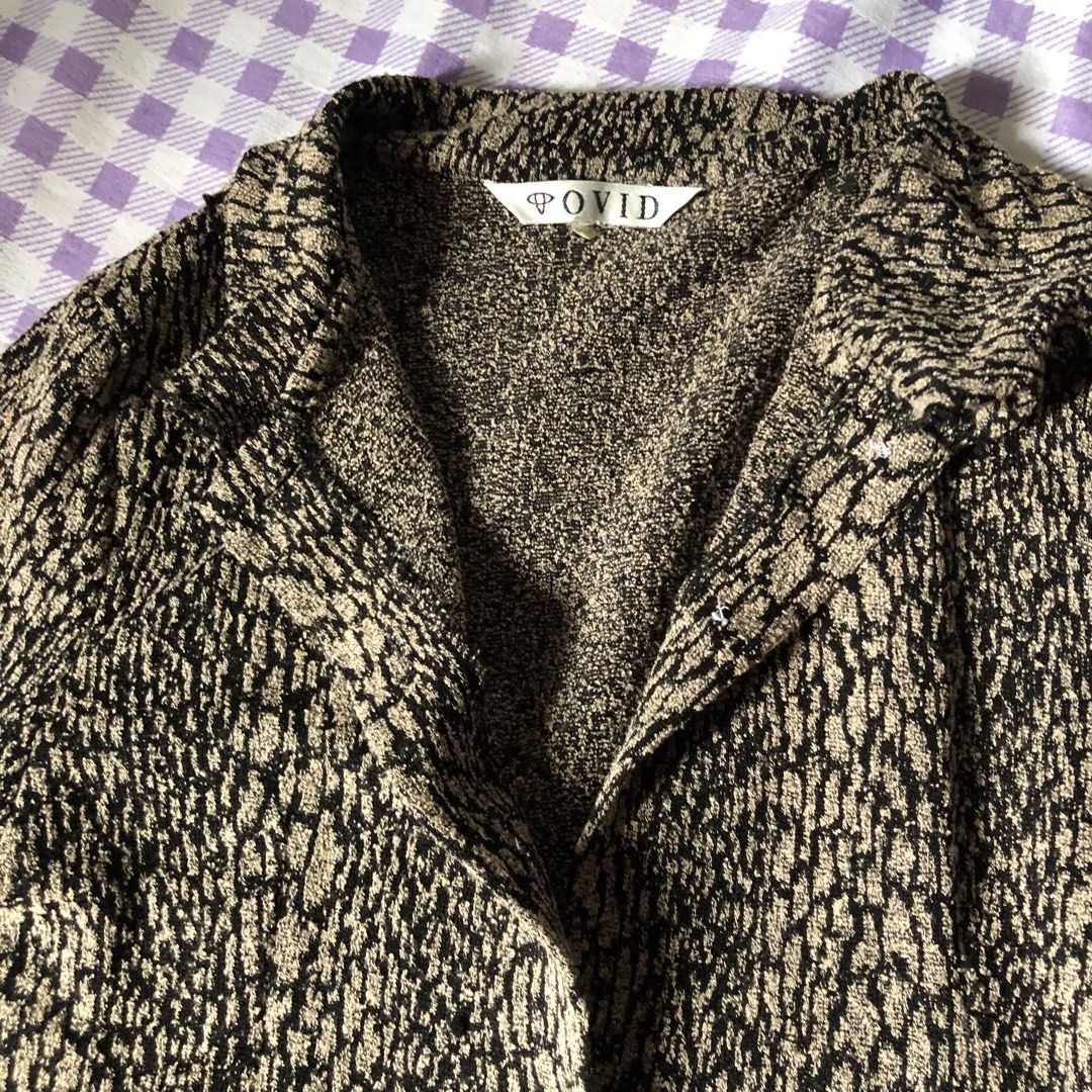Animal Print Y2K Longsleeve Top (Category: Blouses) located in Batangas. Submitted by fairycentral (Listing ID 1416031210, Image 3). Description: - can fit up to med - flaw: missing one button (still looks good without it) - thick fabric .