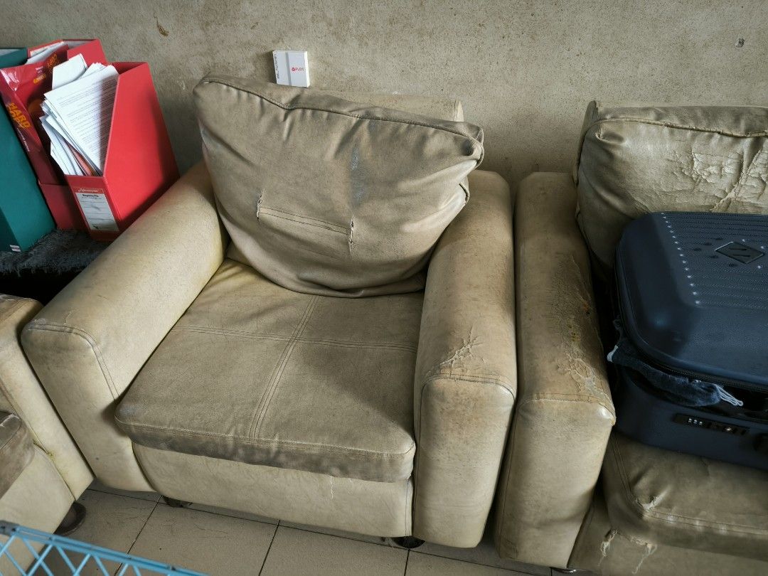 Beige Leather Sofa Set (Category: Sofas) located in Manila. Submitted by cheezu (Listing ID 1416050036, Image 3). Description: - Beige leather sofa set - Includes a three-seater sofa and two single-seater sofa - Three-seater sofa has visible wear and tear - Single-seater sofa includes a pillow.
