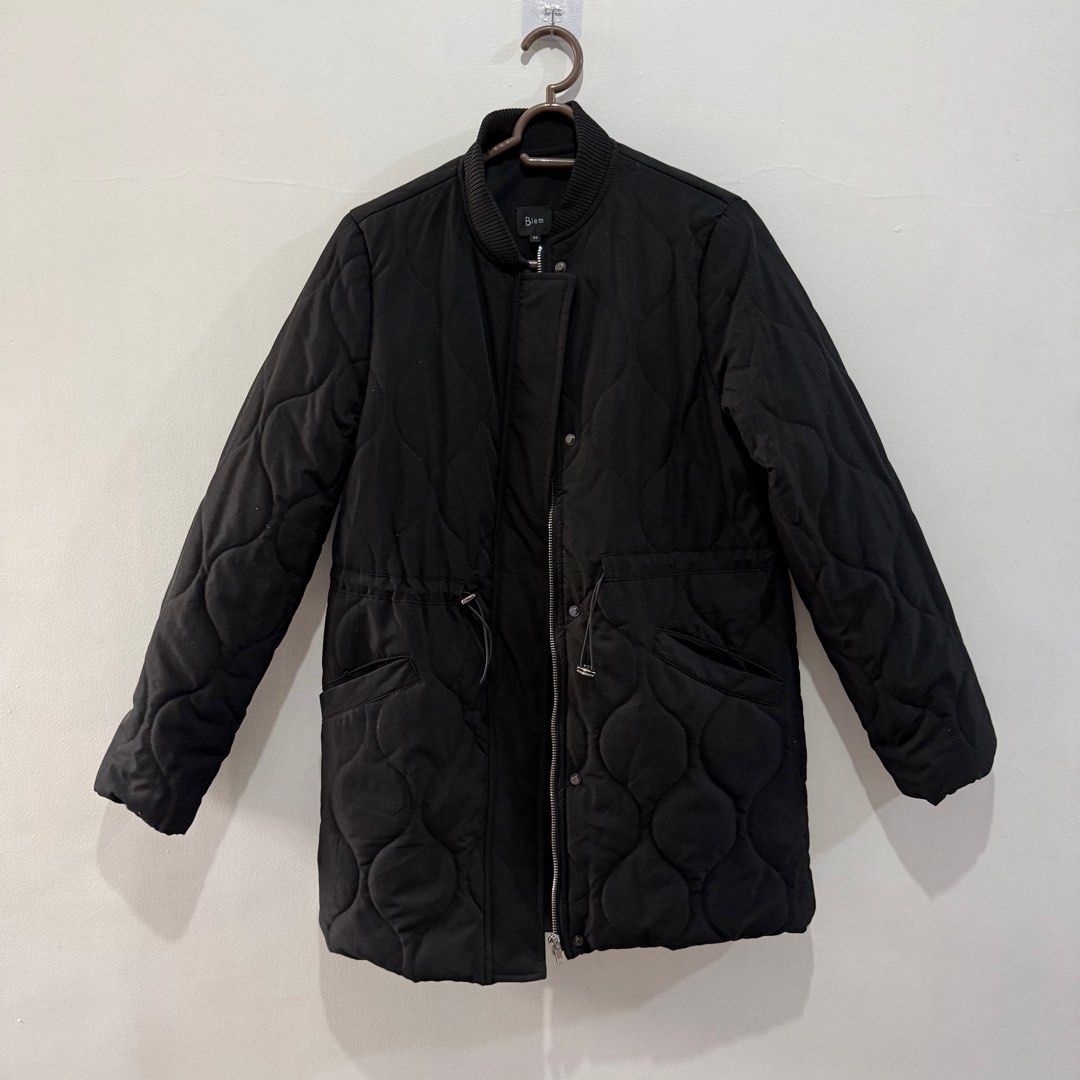 Biem Black Quilted Winter Jacket (Category: Coats, Jackets and Outerwear) located in Binan City. Submitted by ard__ (Listing ID 1416091160, Image 1). Description: - 18W 29L - padded - can send ww - Biem black quilted jacket - Size 36 - Zip and snap button closure - Two front pockets - Drawstring waist - Ribbed collar and cuffs - 100% polyester lining.