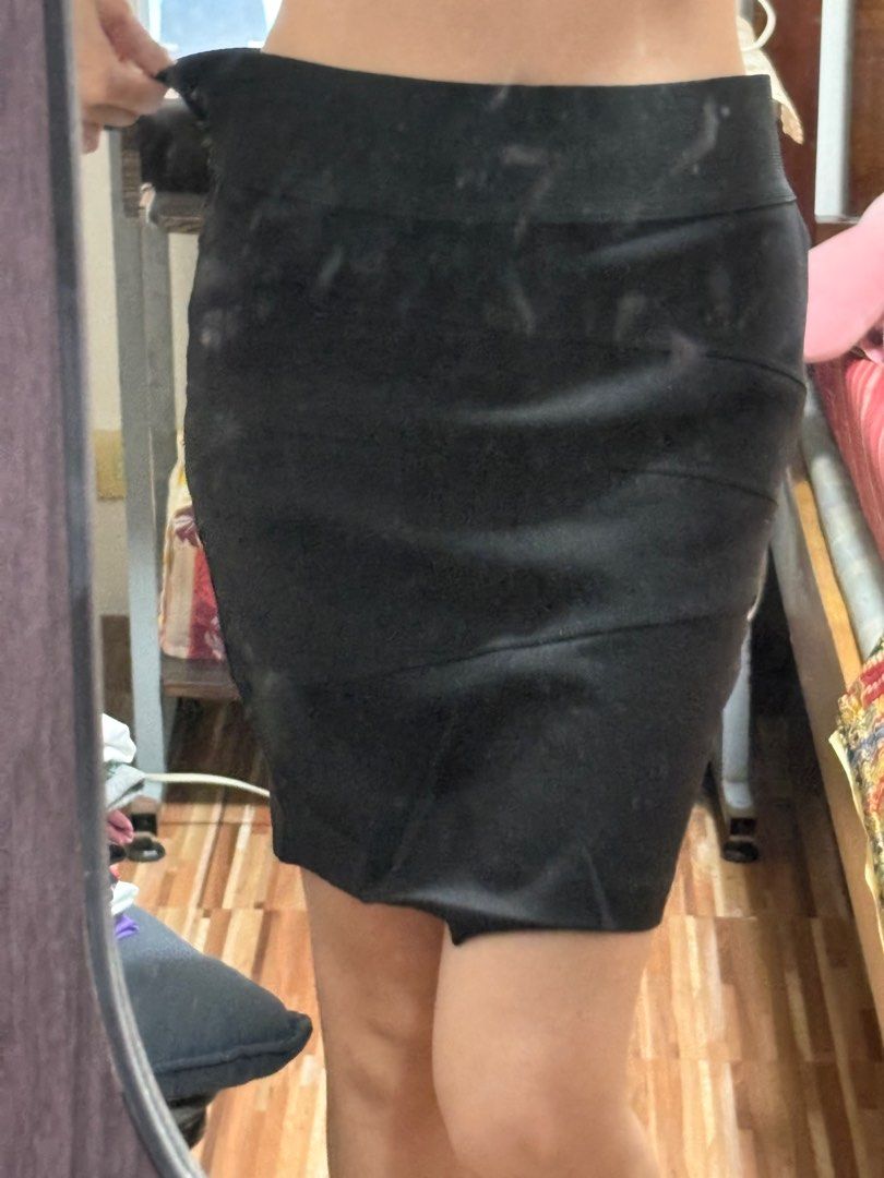 Black Pencil Skirt - XS (Category: Skirts) located in Quezon City. Submitted by yujinify (Listing ID 1416152232, Image 3). Description: Black pencil skirt. Features a stretchy material and a fitted design. The skirt has a high waist and a knee-length hemline. It has a unique design with diagonal seams across the front. Size is XS. Perfect for a variety of occasions. It is sewn in both sides before, but can be removed by buyer if preferred. Waist 