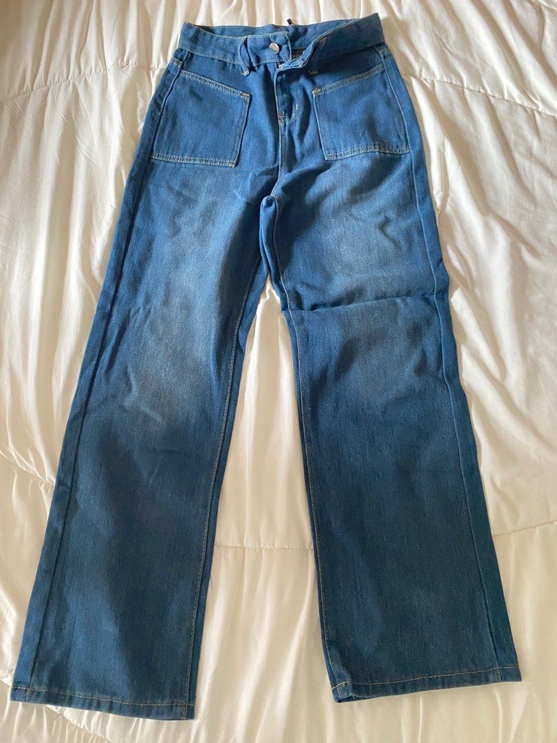 Blue Denim Wide Leg Jeans (Category: Jeans) located in Manila. Submitted by gothel.flaunt (Listing ID 1416018455, Image 2). Description: - Blue denim wide-leg jeans - Medium wash - Two front pockets - Button and zipper closure - Casual style - Suitable for everyday wear.