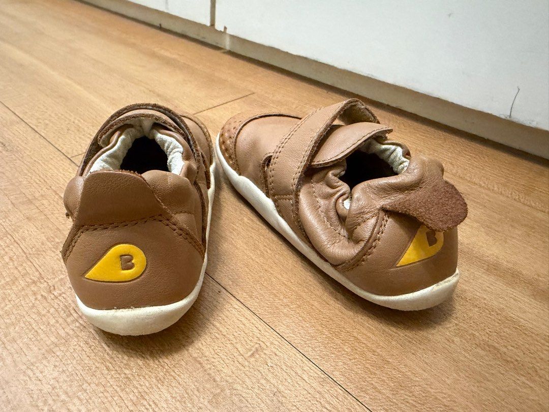 Bobux Step Up Leather Shoes (Category: Babies & Kids Fashion) located in Quezon City. Submitted by rubicscube (Listing ID 1416171006, Image 2). Description: Actual pics posted. Buyer to arrange and pay for pick up from Commonwealth area - Bobux Step Up toddler shoes - Brown leather upper - Hook-and-loop closure for easy on/off - Soft, flexible sole - Padded collar for comfort - Bobux logo detail.