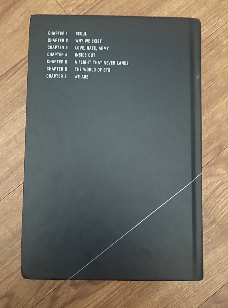 BTS 10-Year Record: Beyond The Story (HARD BOUND) (Category: Storybooks) located in Makati City. Submitted by nicolaylay (Listing ID 1416029254, Image 2). Description: - BTS 'Beyond The Story' book. - Chronicles 10 years of BTS. - Features chapters on various aspects of BTS's journey. - Black cover with title and diagonal lines. - Chapter titles listed on the back of the book..