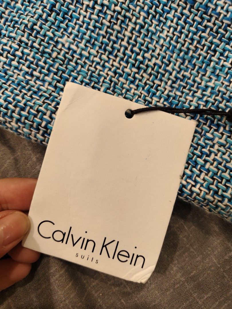 Calvin Klein Blue Tweed Blazer Size 14 (Category: Coats, Jackets and Outerwear) located in Bacolod City. Submitted by mamix (Listing ID 1416097860, Image 3). Description: - Calvin Klein blazer - Vibrant blue tweed - Size 14 - Classic two-button design - Flattering fit - High-quality materials - Perfect for a sophisticated look - Original price: "$139.00".