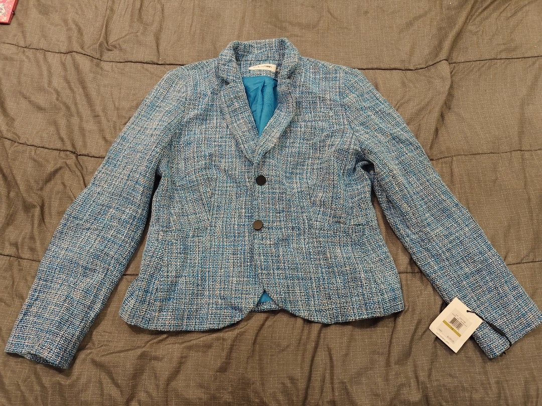 Calvin Klein Blue Tweed Blazer Size 14 (Category: Coats, Jackets and Outerwear) located in Bacolod City. Submitted by mamix (Listing ID 1416097860, Image 1). Description: - Calvin Klein blazer - Vibrant blue tweed - Size 14 - Classic two-button design - Flattering fit - High-quality materials - Perfect for a sophisticated look - Original price: "$139.00".