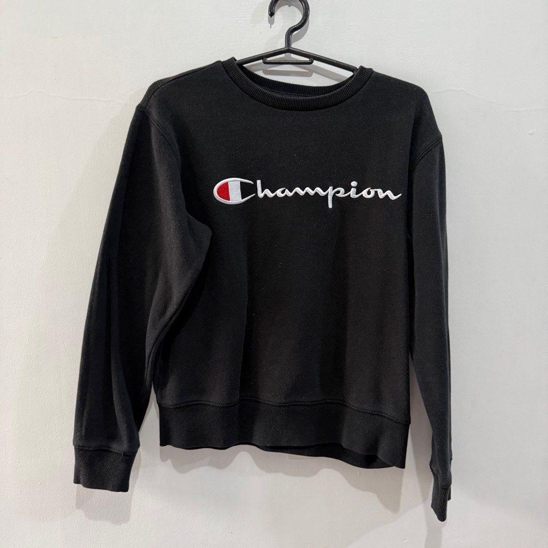 Champion Black Crewneck Sweatshirt - Medium (Category: Coats, Jackets and Outerwear) located in Binan City. Submitted by ard__ (Listing ID 1416082856, Image 1). Description: - 18W 20L - Black Champion crewneck sweatshirt - Size: Medium - Champion logo on the front - Material: 60% cotton, 40% polyester - Authentic athletic wear - Made in China.