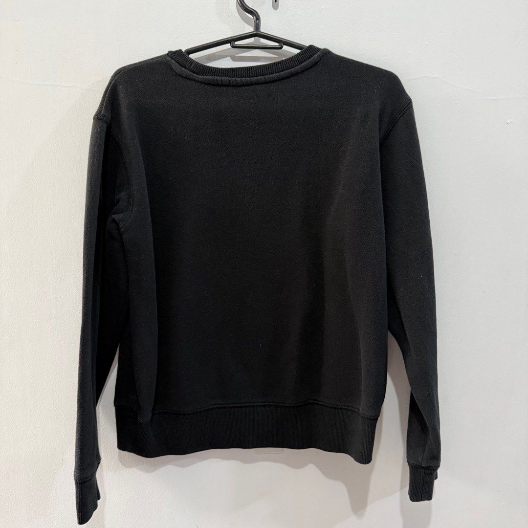 Champion Black Crewneck Sweatshirt - Medium (Category: Coats, Jackets and Outerwear) located in Binan City. Submitted by ard__ (Listing ID 1416082856, Image 2). Description: - 18W 20L - Black Champion crewneck sweatshirt - Size: Medium - Champion logo on the front - Material: 60% cotton, 40% polyester - Authentic athletic wear - Made in China.