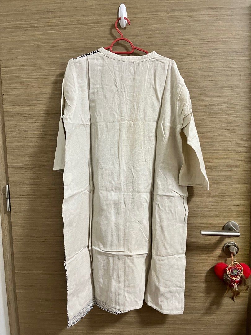 Cream and Patterned punjabi kurta (Category: Dresses) located in Singapore. Submitted by gotfashionfever (Listing ID 1416148065, Image 2). Description: - Cream-colored dress - Patterned front panel - Mandarin collar - Three-quarter sleeves - Linen-like material.