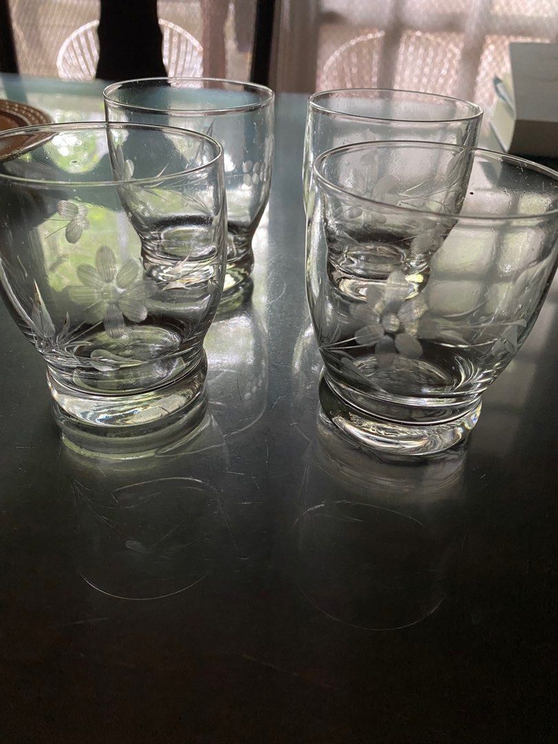 Etched Floral Drinking Glasses Set (Category: Other Kitchenware & Tableware) located in Pasig City. Submitted by ecochicsales (Listing ID 1416022634, Image 2). Description: - Set of four drinking glasses - Features etched floral designs - Rounded shape with a thick base - Vintage style - Ideal for water, juice, and other drinks.