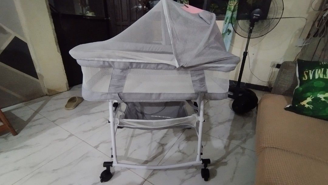 Foldable Baby Crib with Mosquito Net (Category: Cots & Cribs) located in Antipolo. Submitted by jhanetmaysie (Listing ID 1416010927, Image 2). Description: Foldable baby crib features a cute design and comes with a detachable mosquito net for protection. It can be converted into a rocking bed or sleeping basket. The crib has a reinforced carbon steel bracket. It also has a silent wheel for smooth movement. The crib is designed to be easy to store