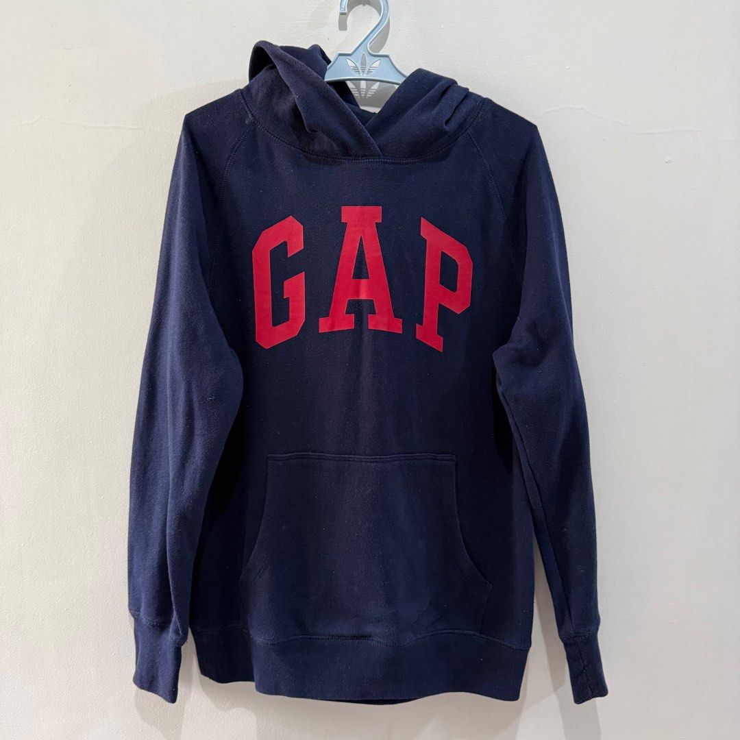 GAP Hoodie - Navy Blue - XS (Category: Coats, Jackets and Outerwear) located in Binan City. Submitted by ard__ (Listing ID 1416078634, Image 1). Description: - 20x23 - CG 10/10 - Navy blue GAP hoodie - Red GAP logo - Size: XS - Material: Cotton-polyester blend - Features: Hood, front pocket - Ribbed cuffs and hem - Soft interior lining.