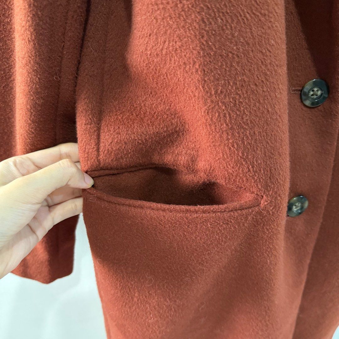 GU Rust-Colored Winter Coat (Category: Coats, Jackets and Outerwear) located in Binan City. Submitted by ard__ (Listing ID 1416087363, Image 3). Description: - 19W 35L - very good condition - GU rust-colored coat - Stylish rust color - Classic design: notched lapel, two front pockets, two-button closure - Made of wool blend - Smooth lining - Size tag is visible - Perfect for a sophisticated look.