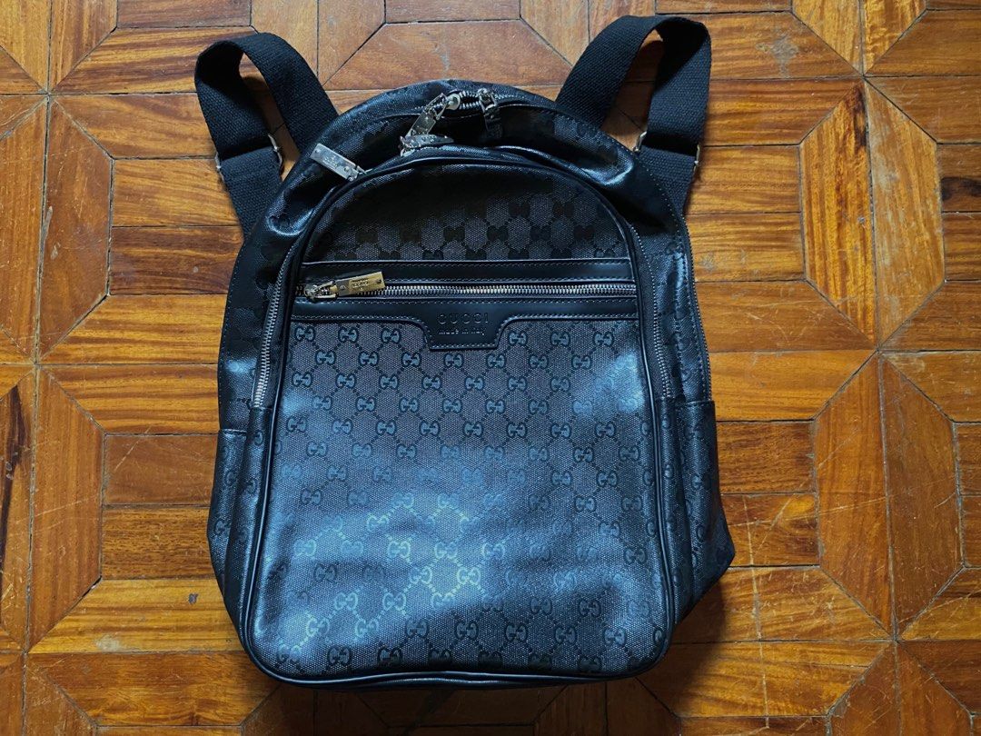 Gucci GG Pattern Backpack (Category: Luxury Bags & Wallets) located in Quezon City. Submitted by kurtdeduyo (Listing ID 1416100796, Image 1). Description: - Authentic Gucci backpack - Iconic GG pattern - Color: Black - Made in Italy - Features: - Zip closure - Front pocket - Adjustable shoulder straps - Silver-toned hardware - Interior: Brown lining with Gucci label RFS: Gift only, Decluttering.