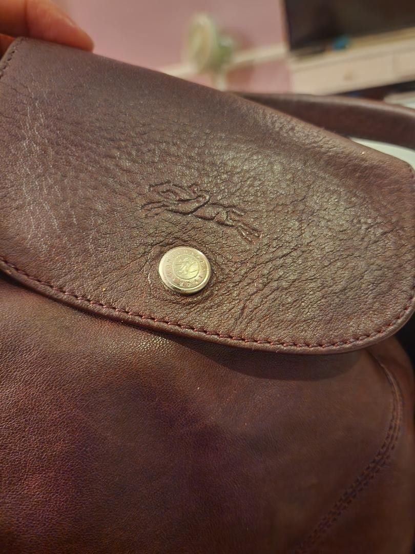 Longchamp Leather Travel Bag (Category: Luxury Bags & Wallets) located in Pasay City. Submitted by 22spc (Listing ID 1416190501, Image 3). Description: - Longchamp leather travel bag - Deep burgundy color - Top handle and detachable shoulder strap - Flap closure with button - Longchamp logo detail - Spacious design - Ideal for travel.