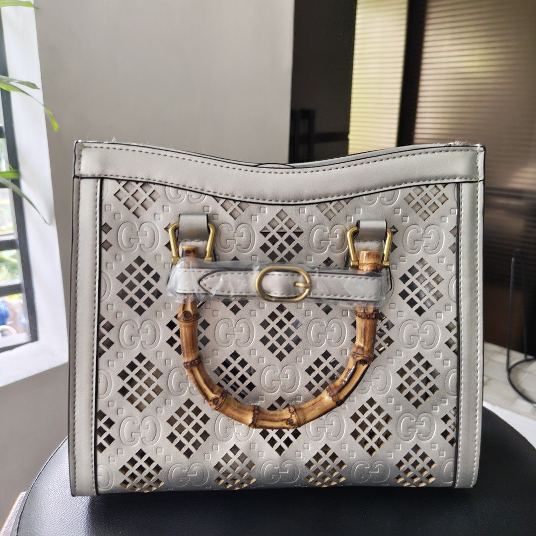 Luxury Bag-Inspired Silver Bamboo Top Handle Bag (Category: Shoulder Bags) located in Imus. Submitted by decluttering_millennial (Listing ID 1416055030, Image 2). Description: - G*cci inspired handbag - Silver exterior with cut-out design - Bamboo handles, detachable strap - Includes 2 detachable straps, dustbag, and box RFS: Gifted but never used.