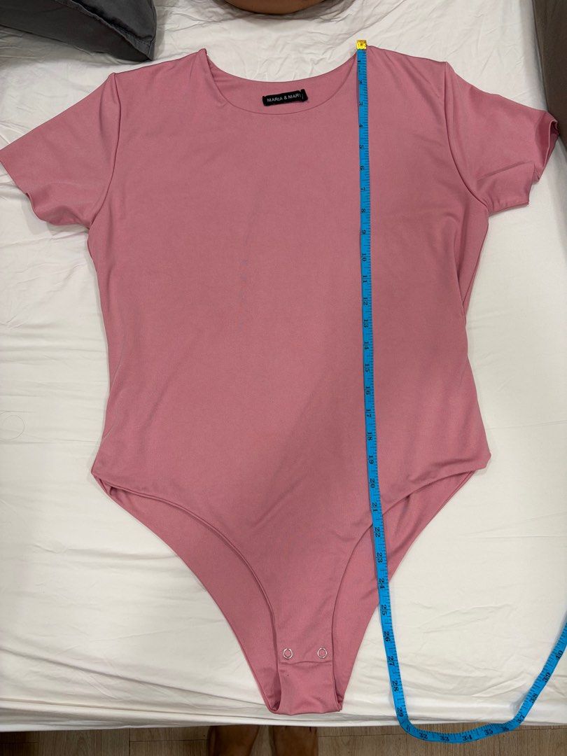Maria & Mary Bodysuit 3X (Category: Others Tops) located in Pasig City. Submitted by sheencf (Listing ID 1416146394, Image 2). Description: - Maria & Mary bodysuit - Color: Pink - Size: 3X - Style: Short sleeves, scoop neck - Closure: Snap closures at the bottom - Measurements: - Length: Approximately 30 inches - Chest: Approximately 20 inches 🛍️RFS: decluttering 💵 MOP: Gcash or BPI online bank transfer 💬PM me if you are interested 🚀Shipping 