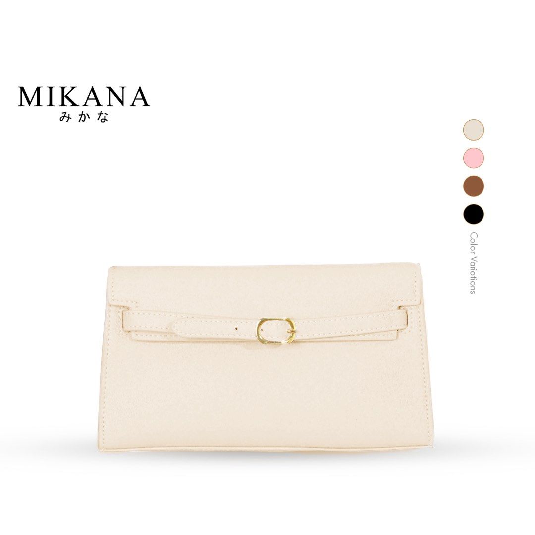 Mikana White Handbag with Buckle (Category: Luxury Bags & Wallets) located in Manila. Submitted by vinniess (Listing ID 1416118243, Image 1). Description: - Mikana beige handbag - Flap closure with gold-colored buckle - Detachable shoulder strap - Textured finish - Versatile: can be worn as a clutch or shoulder bag - Simple and stylish design.