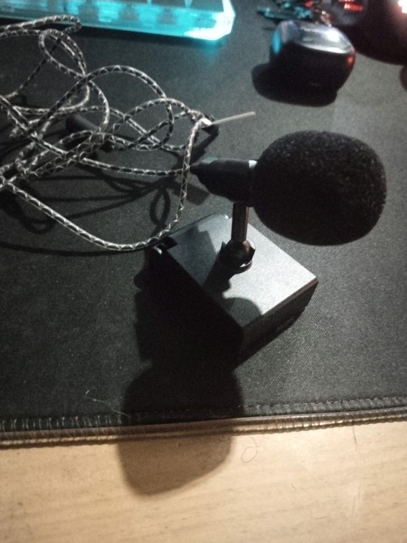 Miniature Microphone with Stand (Category: Microphones) located in Mandaluyong City. Submitted by eyji569 (Listing ID 1416117524, Image 2). Description: - Miniature microphone with stand - Black foam cover - Silver and black braided cable - 3.5mm jack - Black, square stand.