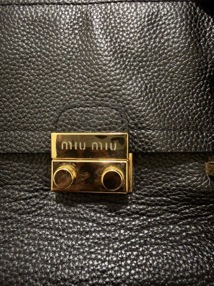 Miu miu madras top handle bag (Category: Luxury Bags & Wallets) located in Manila. Submitted by luvfab (Listing ID 1416145264, Image 2). Description: Miu miu top handle bag Missing/ no sling In good condition Actual photos posted High quality leather bag Authenticity not guarantee but high quality material Slightly negotiable.