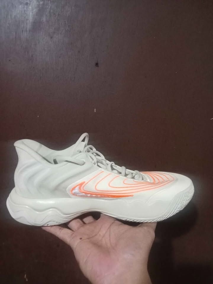 Nike Basketball Shoes (Category: Sneakers) located in Sibulan. Submitted by arrow2022 (Listing ID 1416192245, Image 3). Description: - immortality 4 - Orange and white accents - Unique wavy sole design - Distinctive heel shape - Nike swoosh logo on the side - Laced closure - Padded tongue.