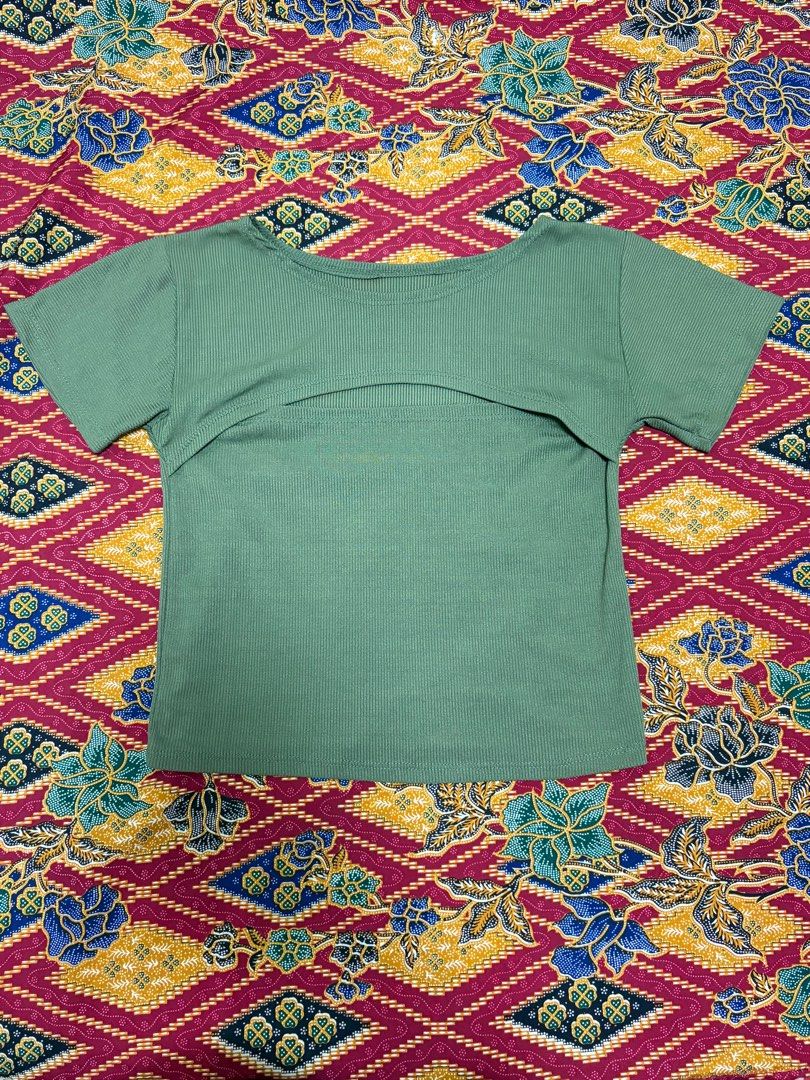Olive Green Crop Top with Slit - Size S (Category: Others Tops) located in Quezon City. Submitted by yujinify (Listing ID 1416152772, Image 1). Description: - Olive green crop top - Size: Small - Design: Unique slit - Sleeves: Short - Neckline: Round - Material: Ribbed - Style: Casual and stylish.