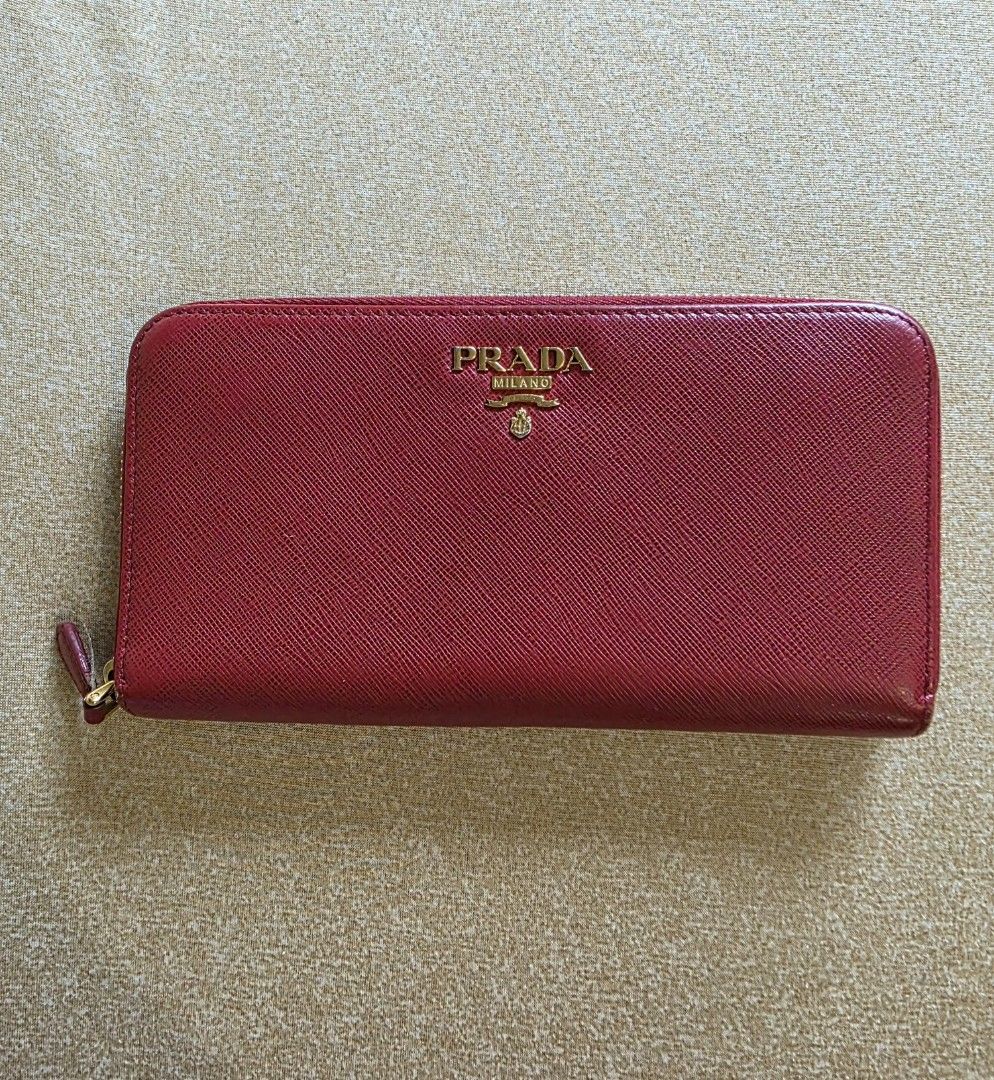 Original Prada Red Saffiano Leather Zip Long Wallet (Category: Wallets & Card holders) located in Makati City. Submitted by thisisanne (Listing ID 1416049151, Image 1). Description: Original Prada Red Saffiano Leather Zip Wallet Selling for Php9999 In very good condition Decluttering PM for inquiries Shipping fee c/o buyer Meet up Makati.
