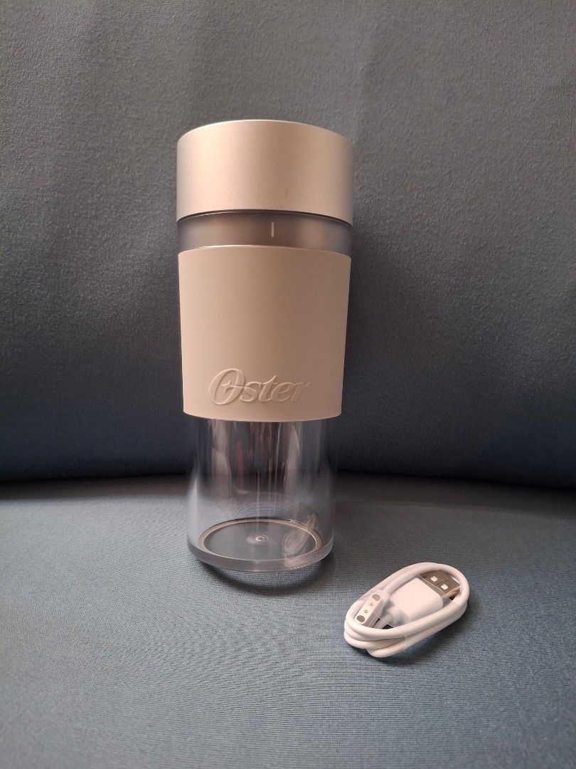 Oster Cordless Mini Blender 300mL (Category: Juicers, Blenders & Grinders) located in Manila. Submitted by mamanilala (Listing ID 1416026833, Image 2). Description: Oster Mini Cordless Blender Quick Charge: Battery charges in under 2.5 hours (up to 10 blending cycles) One-Touch Controls: Easy to use with one-touch controls Safety Design: Magnetic safety design ensures blades only run when the lid is on Nonslip Sleeve and Feet: Blend right into th