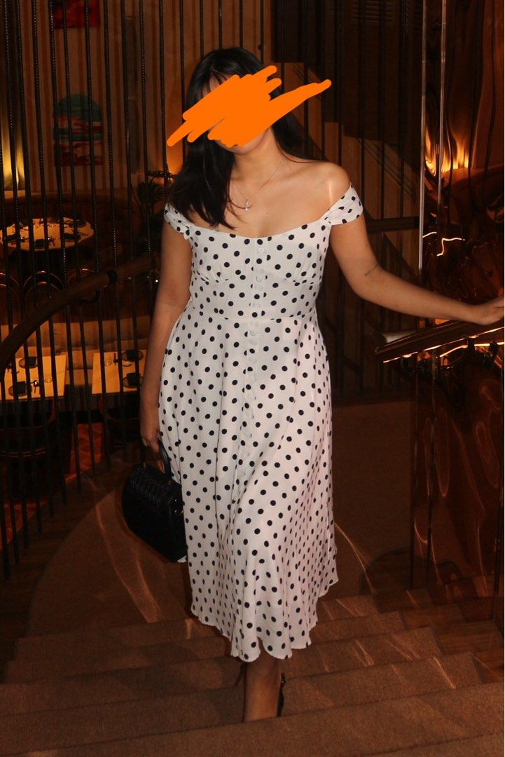Polka Dot Two Way Off-Shoulder Dress (Category: Dresses) located in Pateros City. Submitted by nixoleil (Listing ID 1409886537, Image 1). Description: - Polka Dot Two Way Off-Shoulder Dress - White dress with black polka dots - Off-shoulder design - Button-down front - Fitted bodice - Flared skirt - Sweetheart neckline - Adjustable straps - Made of lightweight fabric - Fits Medium to Semi-Large - Perfect for Christmas - Long dress .