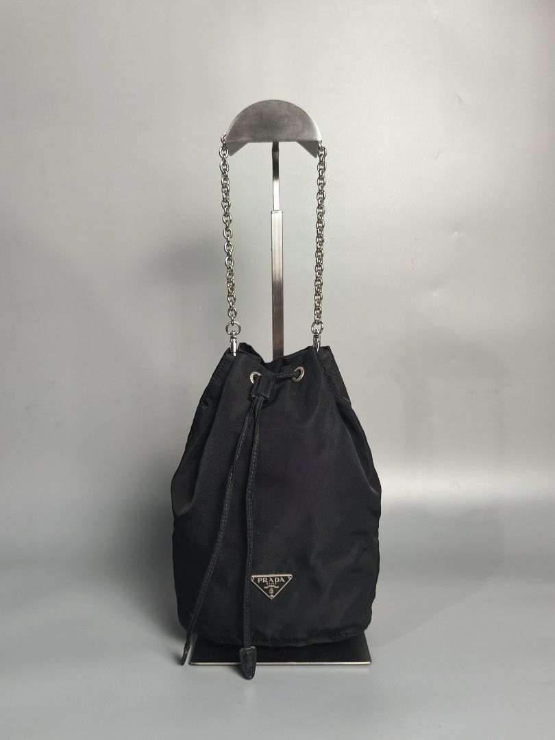 Prada Tessuto Nylon Pouch (Category: Luxury Bags & Wallets) located in Bulacan. Submitted by 4kcollection.ph (Listing ID 1416017318, Image 1). Description: Prada Tessuto Nylon Pouch Pre-loved from Japan Very Good Condition Intact white tag #29 Provided Prada chain Need clean inside No Flaws Dm for sure buyer 📩 MOP: Gcash / Maya / BPI Courier: J&t / Lbc / Lalamove Location: SJDM Bulacan.