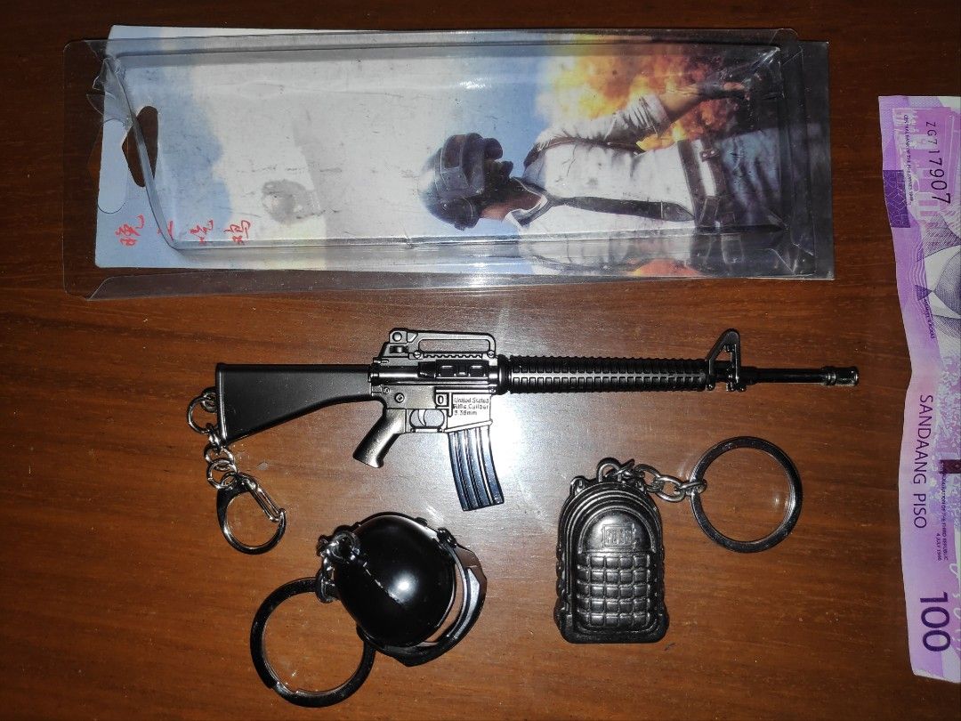 PUBG Keychains Set (Category: Western Merchandise) located in Quezon City. Submitted by j.c.declutter (Listing ID 1416152546, Image 1). Description: PUBG (Player Unknown Battlegrounds) - Rifle keychain with "United States Rifle Caliber 5.56mm" print - Black grenade keychain - Detailed black backpack keychain - All keychains include a keyring - 100 each, Take All for 199.